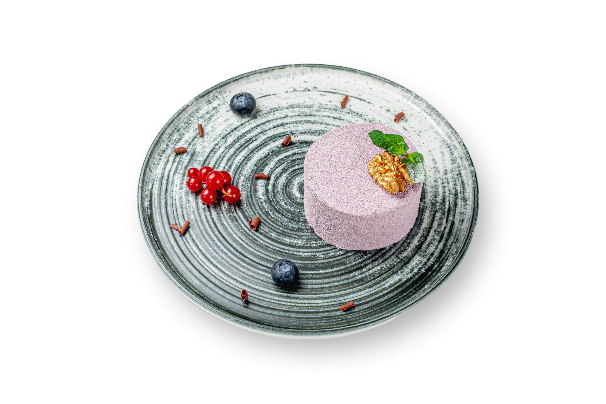 Close-up of plated dessert with molecular garnish